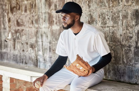Black man, baseball or catch glove on sports, stadium or arena bench for game, match or serious competition. Concentration, athlete or softball player mitten for fitness, workout or exercise training