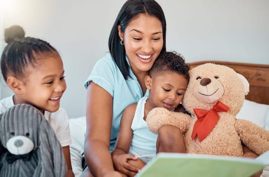 Relax, storytelling and book with mother and children for learning, fantasy or creative in family home. Happy, bonding and smile with mom reading to kids in bedroom to study, education and teddy bear