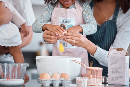 Baking, egg and mother helping her child in the kitchen to bake a cake, cookies or pie together. Ingredients, bonding and woman cooking a lunch meal with her daughter for event or party at their home