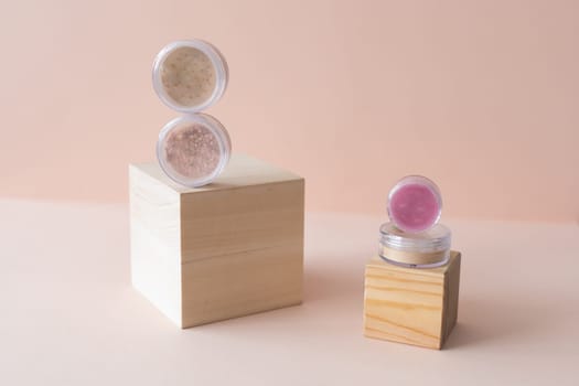 Mineral loose face powder on pastel background. Eyeshadows and blush powder eco friendly natural products