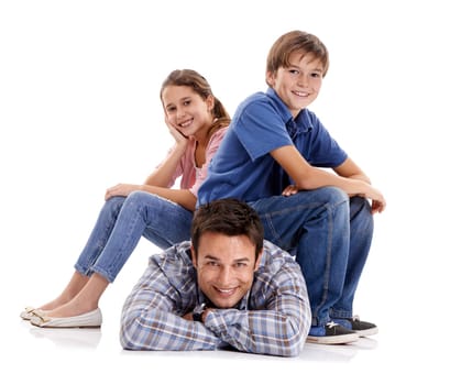 Laid-back parenting Nah. Portrait of a loving father and his children isolated on white.