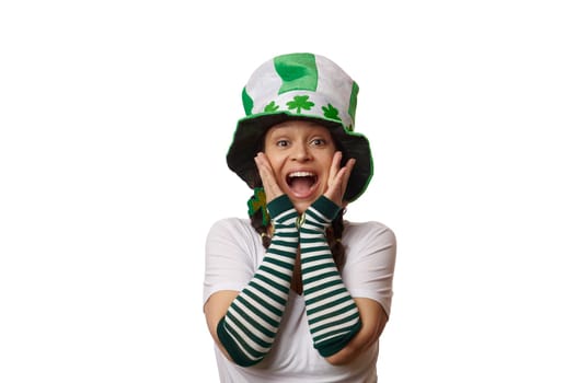 Charming woman dressed as Leprechaun for St Patrick's pub party, expressing amazement and surprise on a white background