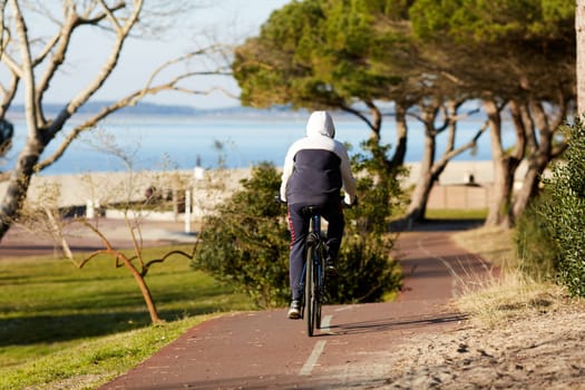 Person riding a bicycle on a cycle path