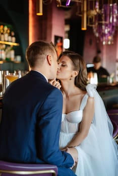 bride and groom inside a cocktail bar