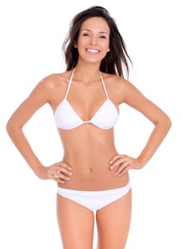 Shes proud of her bikini body. Studio portrait of a beautiful woman in a bikini with her hands on her hips isolated on white.
