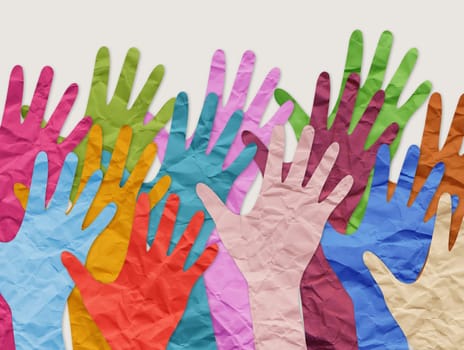Collage of colorful paper hands as symbol of diversity and inclusion.