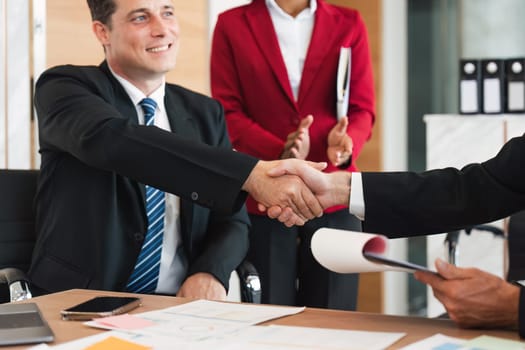 Business handshake for teamwork of business merger and acquisition, successful negotiate, businessman shake hand with partner to celebration partnership and business deal concept.