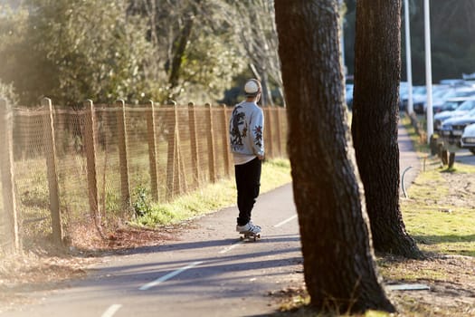 skateboarder riding the bike path