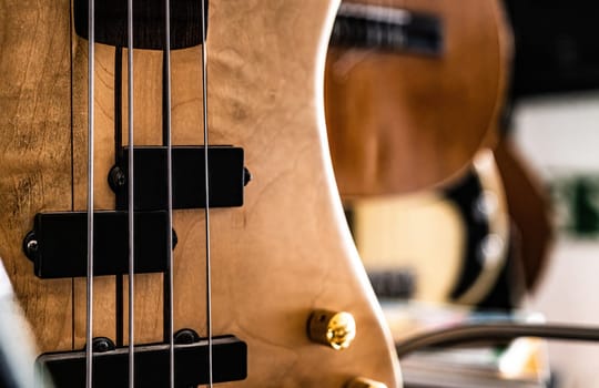 Bass guitar fretboardsand strings in music recording studio