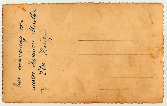 Back of a vintage photo - postcard. Rich stain and paper details. Can be used as background. Image contains handwriting.