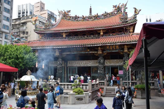 Group of tourists at Monga Longshan Temple in Taiwan