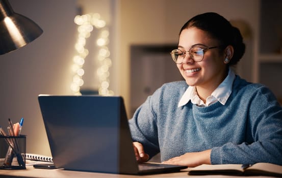 Business, student or laptop in night home office on financial software, investment data or savings growth analytics. Smile, happy or working late woman on technology for finance learning or education
