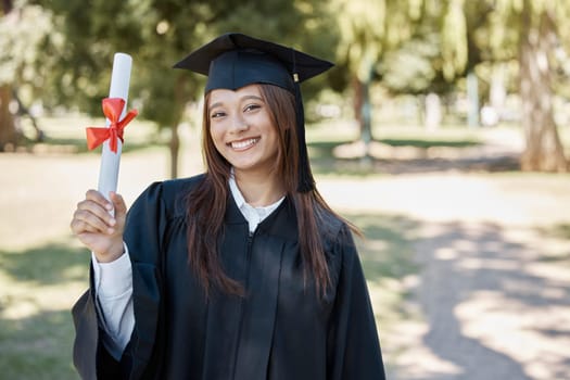 Graduation award, university and portrait of girl on campus with smile for success, diploma and achievement. Education, college and happy female graduate with certificate, degree and academy scroll