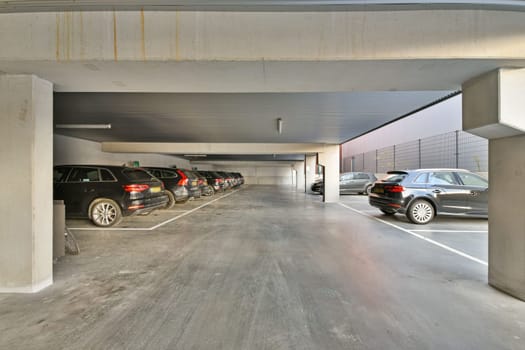 a parking garage with cars parked in it