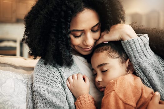 Family, love or child hug mother for Mothers Day, home bonding or embrace on living room couch. Care, custody and biracial mom, mama or woman with female youth kid, girl or daughter cuddle on sofa
