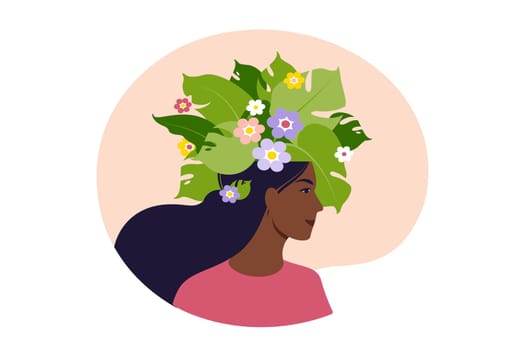 Mental health, happiness, harmony concept. Happy african female head with flowers inside. Mindfulness, positive thinking, self care idea.
