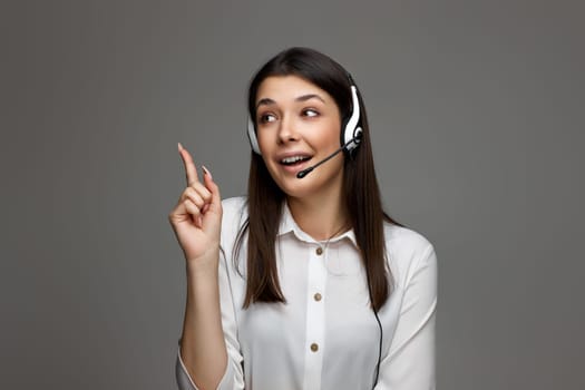 friendly smiling woman with headset is consulting clients online.