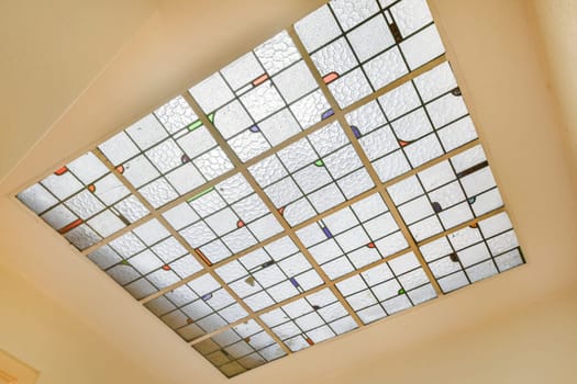 a stained glass skylight in a ceiling