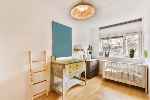 a nursery with a crib and a dresser in