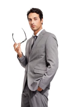 Business ambition and intelligence. A confident young businessman holding a pair of glasses on a white background.