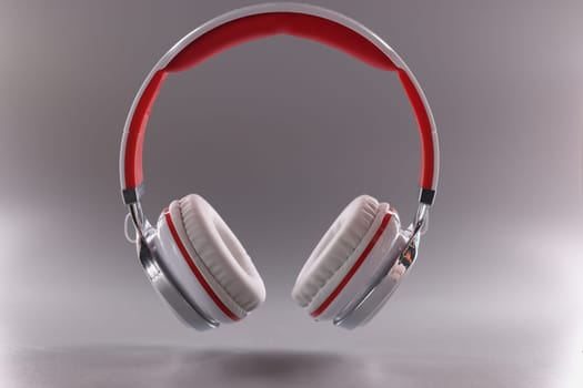 White red modern headphones on gray background