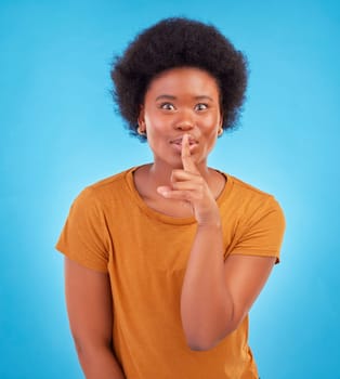 Secret, portrait and black woman with finger on lips in studio, background and privacy of drama news. Excited model, silence and shush on mouth, quiet emoji or whisper gossip of confidential surprise