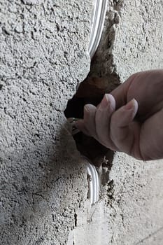 installation of an electrical outlet in a concrete wall
