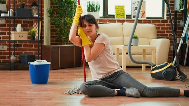 Female person feeling tired after finishing spring cleaning