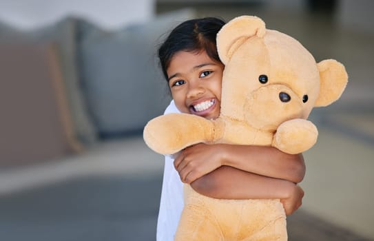 This is my best friend. a little girl holding her teddy bear.