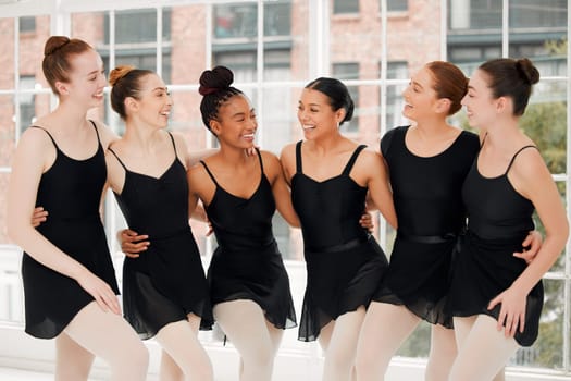 No one gets left behind. a group of ballet dancers laughing together.