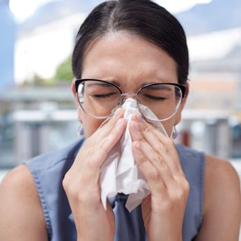 Entrepreneur, flu and woman with tissue, allergy and manager with glasses, sickness and safety. Female employee, business owner and administrator with toilet paper, blowing nose or fever in workplace