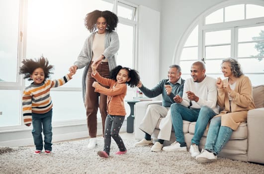 Black family, vacation and mother playing with children in a home in winter and bonding together in a house. Parents, grandparents and mom play with kid having fun in a living room on a getaway