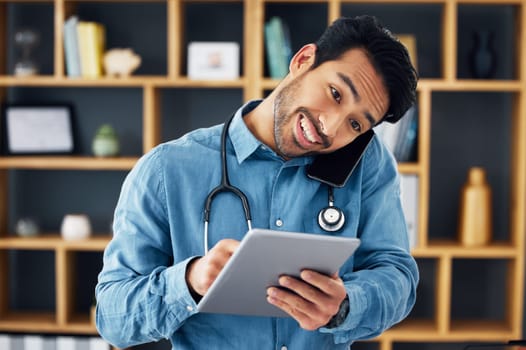 Phone call, tablet and telehealth by doctor using technology for medical communication or consulting online. Digital, smile and man healthcare professional typing and talking on mobile conversation.