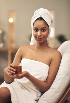 Yeah its a luxury, but its also a necessity. a woman drinking tea while enjoying a spa day