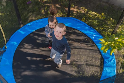 children jump on the trampoline
