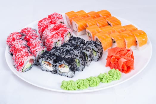 Japanese seafood Sushi roll isolated on white close up. Japanese food restaurant, sushi maki gunkan roll plate or platter set. Maki Sushi rolls with salmon and avocado. Sushi isolated at white background. flat lay. Japanese Cuisine - Sushi Roll with Shrimps and Conger, Avocado, Tobiko and Cheese. sushi rolls tempura,japanese food style ,Traditional Japanese cuisine, Crunchy Shrimp Tempura Roll