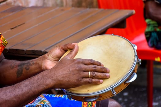 Brazilian samba performance with musician playing tambourine