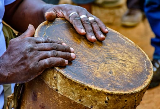 Percussionist playing a rudimentary atabaque