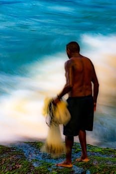 Motion blurred image with fisherman