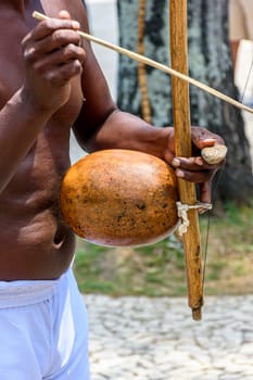 Musician playing a traditional Brazilian percussion instrument