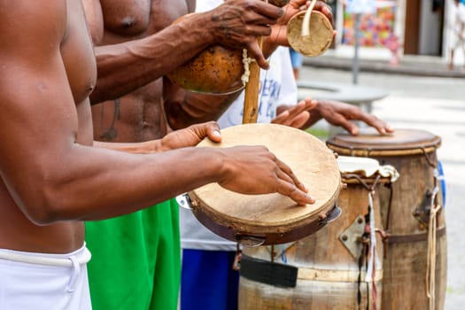 Musicians playing typical instruments of African origin
