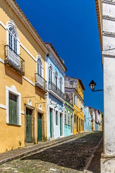 Cobbled streets and slopes and colorful colonial-style historic houses