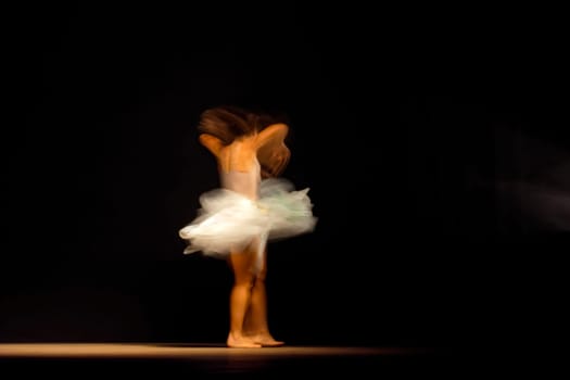 Young dancer with motion blurred