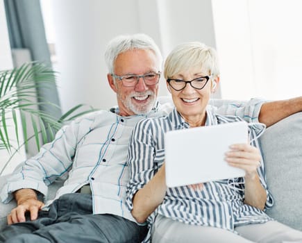 senior couple happy tablet computer love together techology internet retirement online man woman elderly
