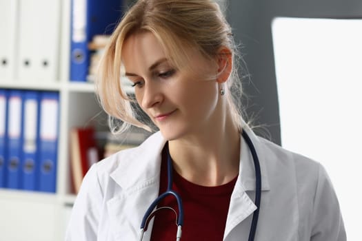 Portrait of sad female doctor in clinic