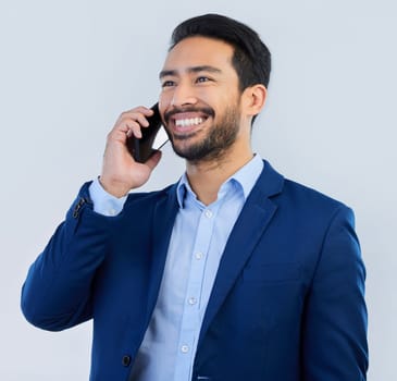 Smile, smartphone and Indian man in studio, talking and networking on white background. Phone call, conversation and businessman in suit, communication and technology for investor trading at startup