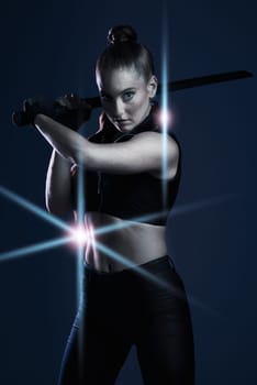 Warrior, woman and sword portrait to fight in studio for action on dark background. Strong female model, assassin or agent scifi futuristic cosplay costume with weapon as ninja or vigilante mission