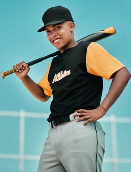 The harder you work, the harder it is to lose. a young baseball player holding a baseball bat while posing outside on the pitch.