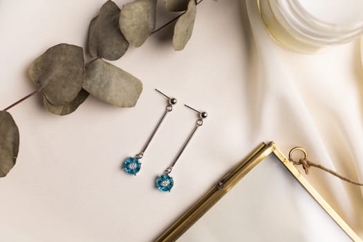 Elegant jewelry set of silver earrings with gem. Jewelry set minimalist style. Handmade bijouterie concept.