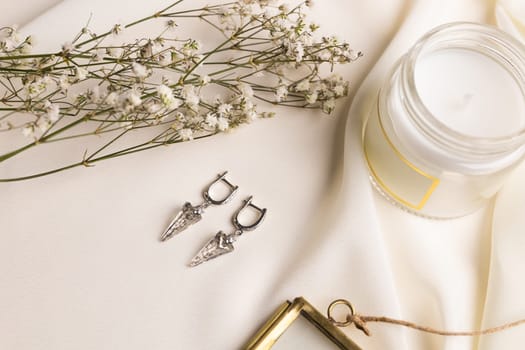 Elegant jewelry set of silver earrings with gem. Jewelry set minimalist style. Handmade bijouterie concept.
